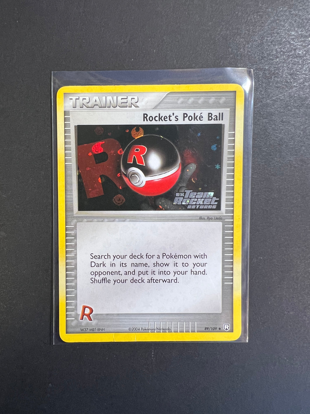 Rocket’s Poke Ball - 89/109 “Stamped” Reverse Holo Trainer - EX Team Rocket Returns