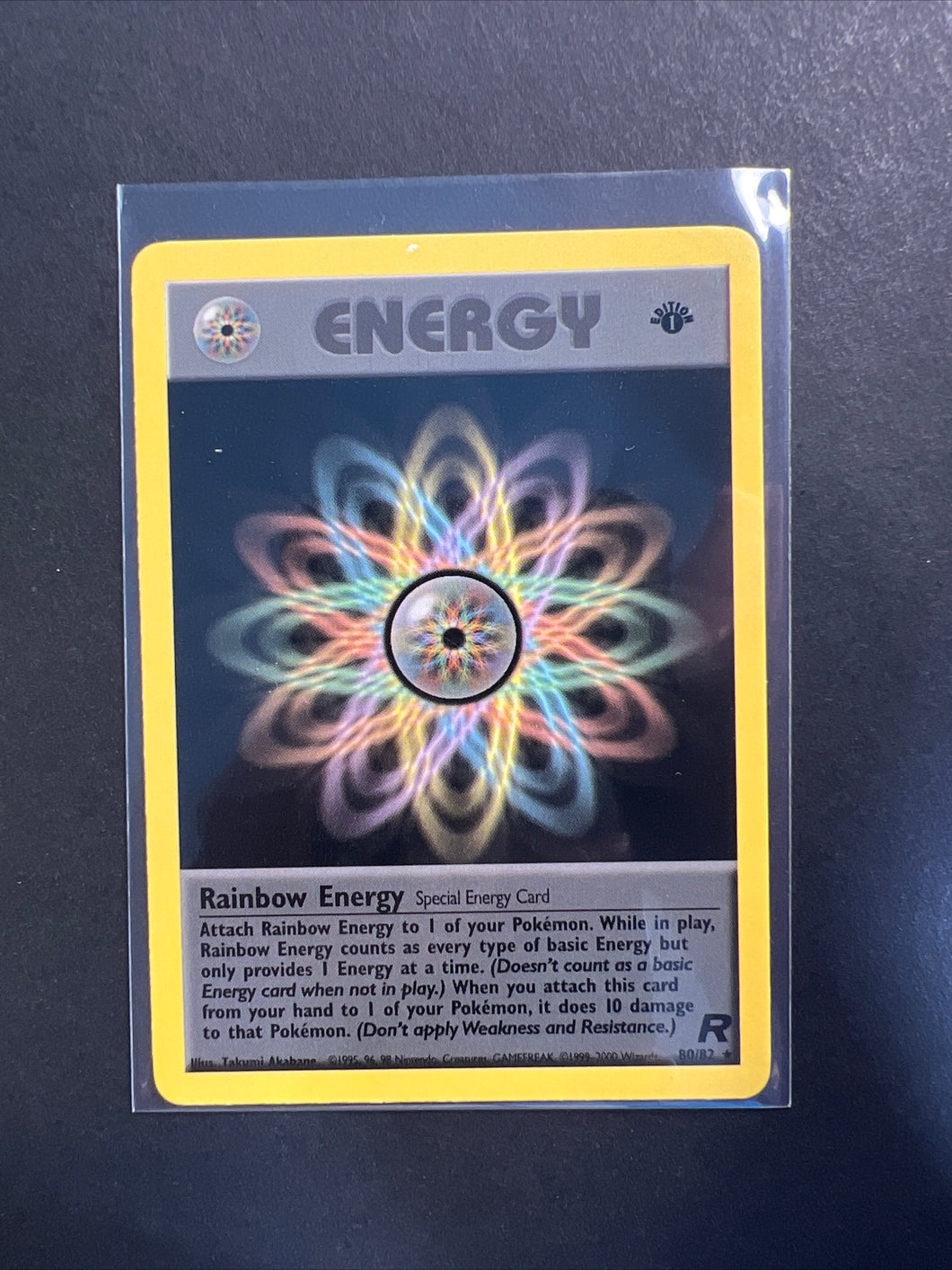 Rainbow Energy 1st Edition - 80/82 Non-Holo Rare - Team Rocket